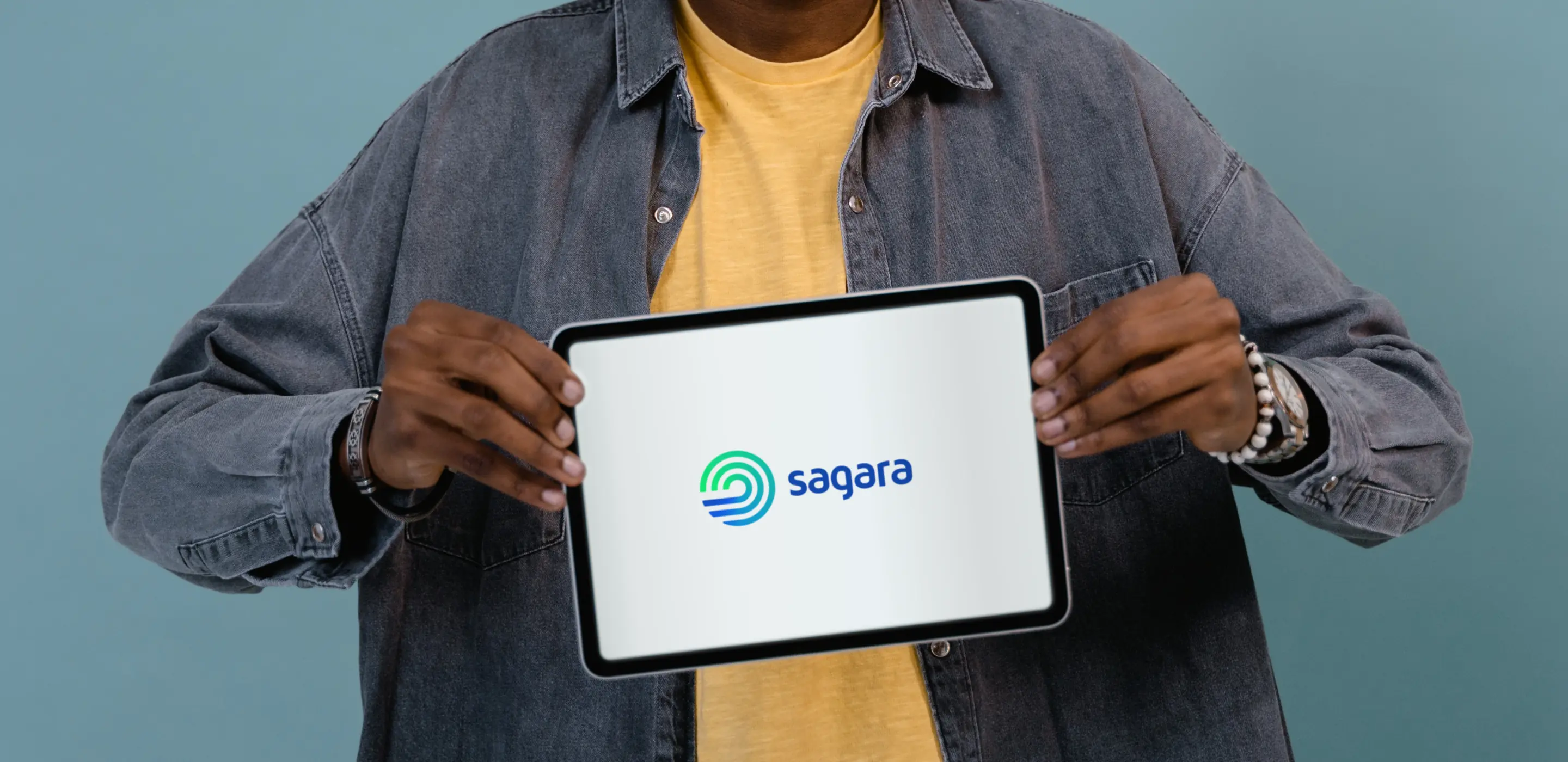 An person holding a tablet with Sagara Logo