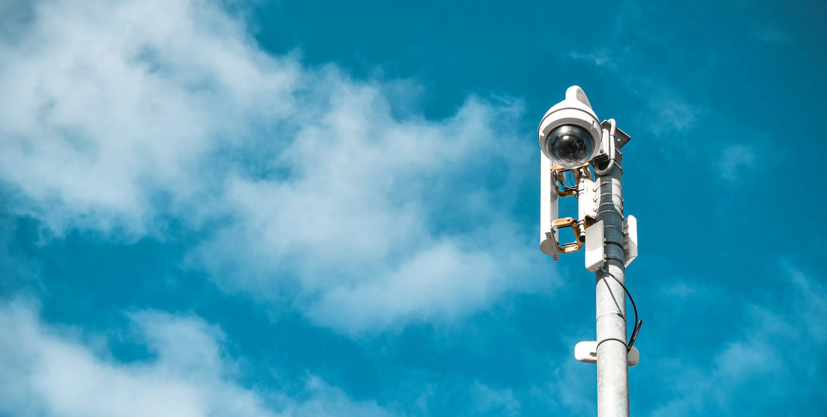 A CCTV with clear sky on the background